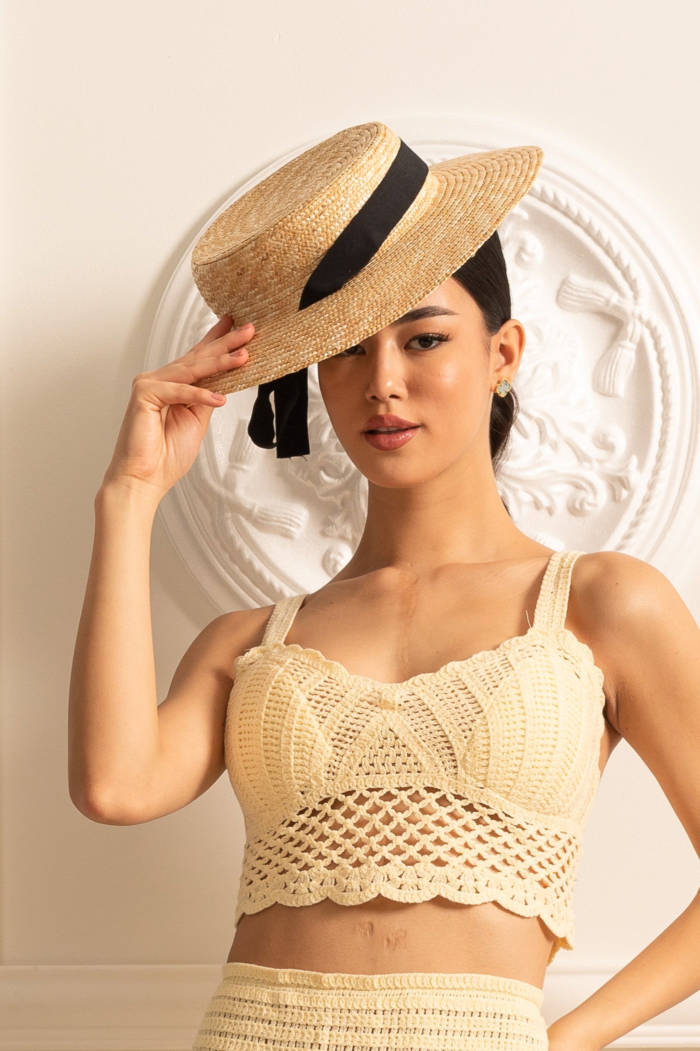 Wide-Brimmed Straw Hat With Black Ribbon Accent