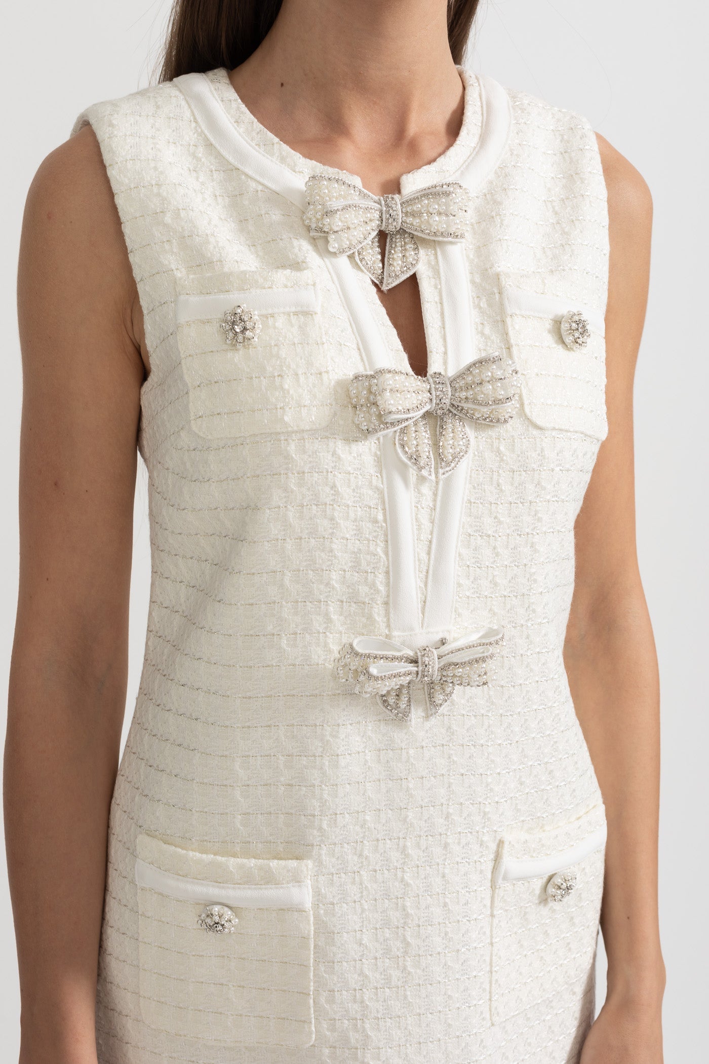 Textured Sleeveless Dress With Metal Embellished Bows - White