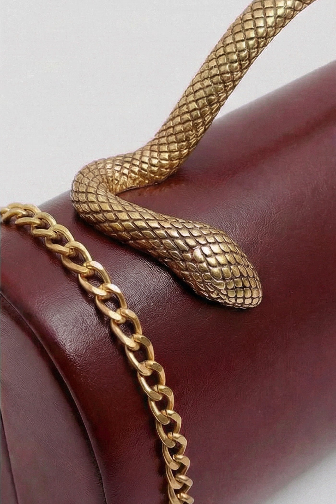 Structured Clutch Bag with Snake Handle And Gold Chain – Burgundy